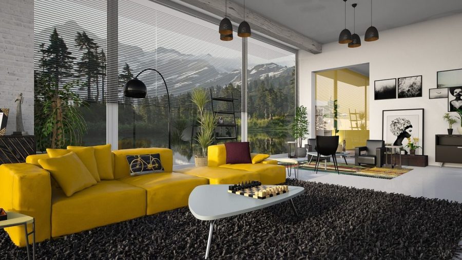 claves-estilos-salones-modernos-sofa-amarillo-cuadros--ventanal-montana-ajedrez